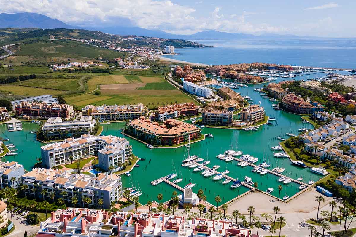 Port of Sotogrande. Sotogrande Marina. Beautiful colourful houses in the port, sea, boats and yachts. Sotogrande, San Roque, Cadiz, Costa del Sol, Andalusia, Spain